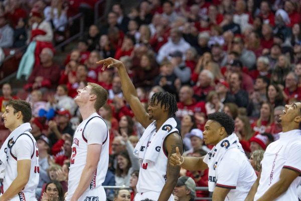 Badgers basketball teams celebrates a three-pointer on the sidelines. January 3, 2025. 