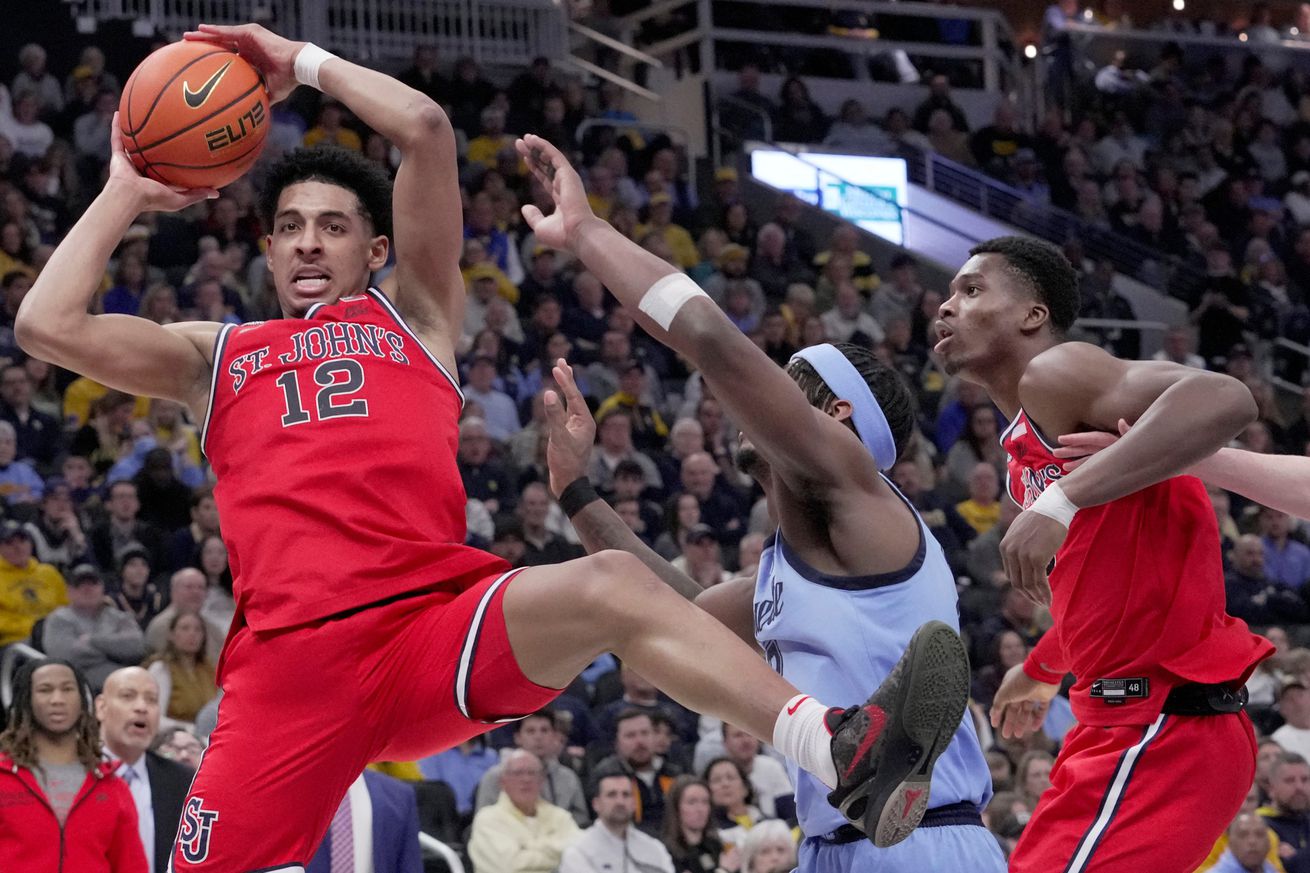 St. John’s guard RJ Luis Jr. (12) out rebounds Marquette guard Chase Ross (2) during the second half of their game Saturday, March 8, 2025 at Fiserv Forum in Milwaukee, Wisconsin. St. John’s beat Marquette 86-84 in overtime.