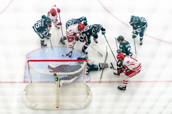 The UW Women's Hockey team battles for a goal against Michigan State. March 1, 2025. 